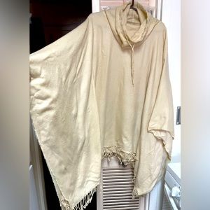PONCHO/CAPE STYLE CREAM COLORED WITH 10 “ NECK WITH TIE 33”L to 38”point